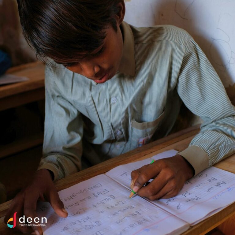 School boy studying in rural Pakistan at Deen Trust International School for Underprivileged