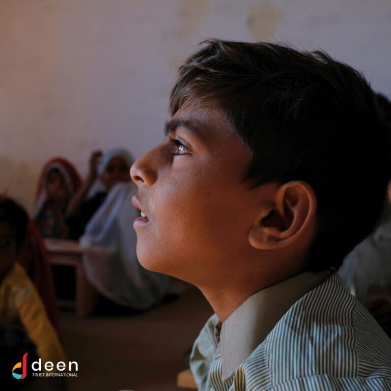 School boy studying at Deen Trust International School of the Underprivileged